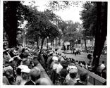 Mayor William Anderson of Oakville and Mayor Robert John Pratt of Dorval Quebec spectating the St. Jean Baptiste Parade in Montreal Quebec on Rue Sherbrook East facing East towards Rue St-Hubert.