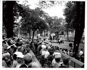Mayor William Anderson of Oakville and Mayor Robert John Pratt of Dorval Quebec spectating the St. Jean Baptiste Parade in Montreal Quebec on Rue Sherbrook East facing East towards Rue St-Hubert.