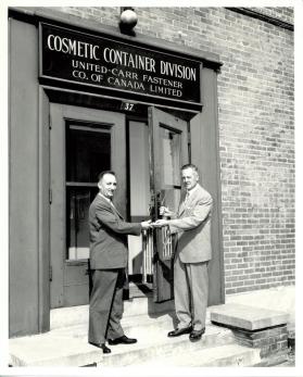 Mr. A. F. McKay, General Manager of Sterling Faucet Canada Limited accepting keys from Mr. R. M. Healey, President of United Carr Fastener Company of Canada Limited.