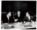 Three Men sitting in a Restaurant