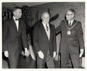 Mayor F. McLean Anderson (R) escorting Hon. Earl Rowe (C) inside the Centennial Center (Central Library)
