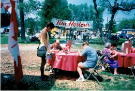 People at the Oakville Waterfront Festival at Coronation park filling out Speak Out!... Canada... Pensons-y! Ballot entries