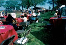 People at the Oakville Waterfront Festival at Coronation park filling out Speak Out!... Canada... Pensons-y! Ballot entries