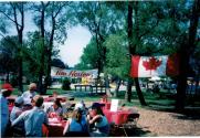 People at Coronation park during the Oakville Waterfront Festival filling out Speak Out!... Canada... Pensons-y! Ballot entries