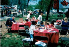 People at Coronation park during the Oakville Waterfront Festival filling out Speak Out!... Canada... Pensons-y! Ballot