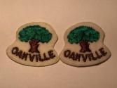 Two "Oakville" embroidered stickers on felt