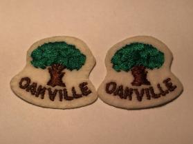 Two "Oakville" embroidered stickers on felt